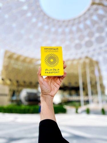 Hand holding Dubai expo 2020 passport Hand holding Dubai expo 2020 passport
